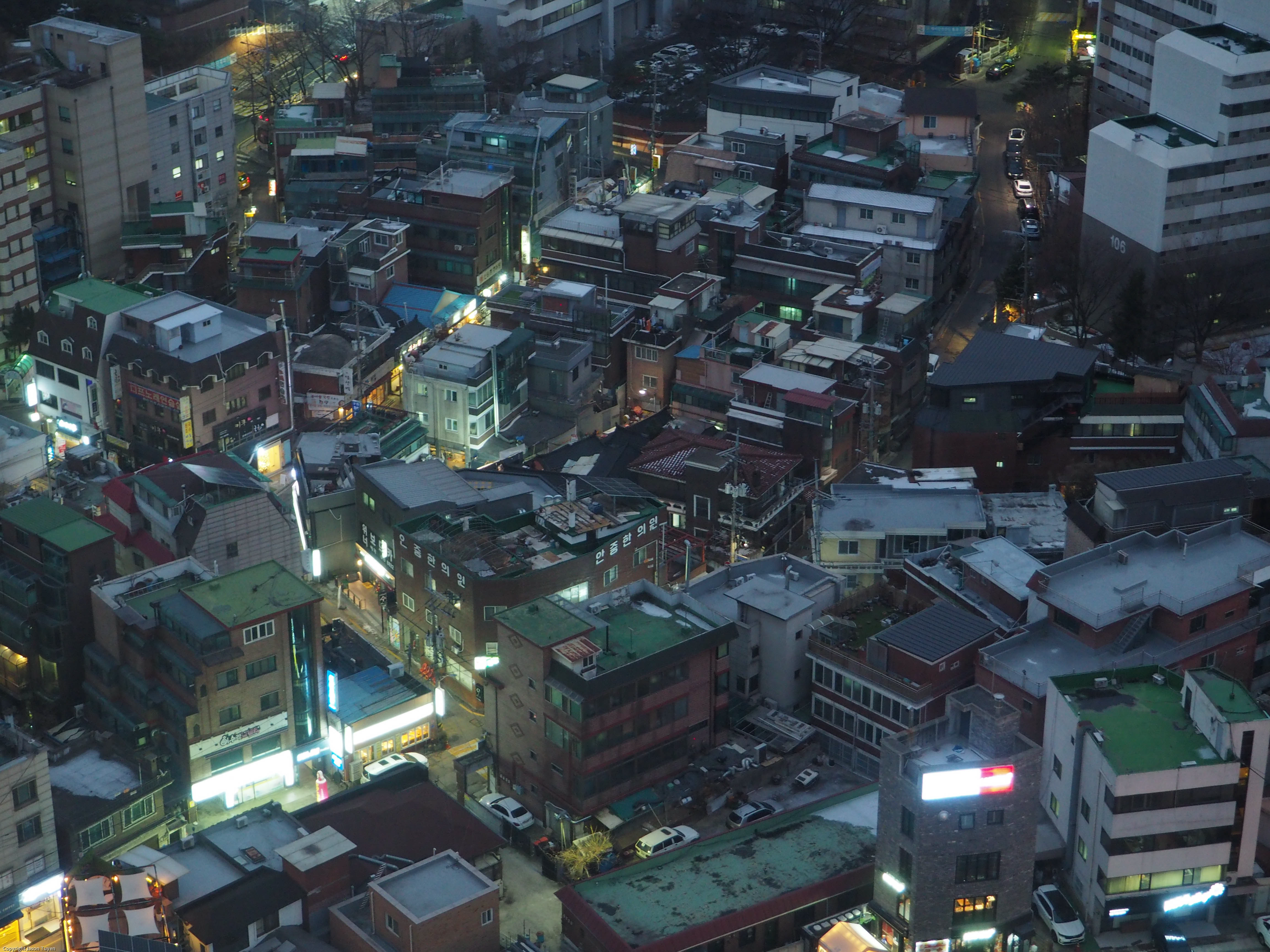 Aerial view of a Seoul neighborhood during sunset.