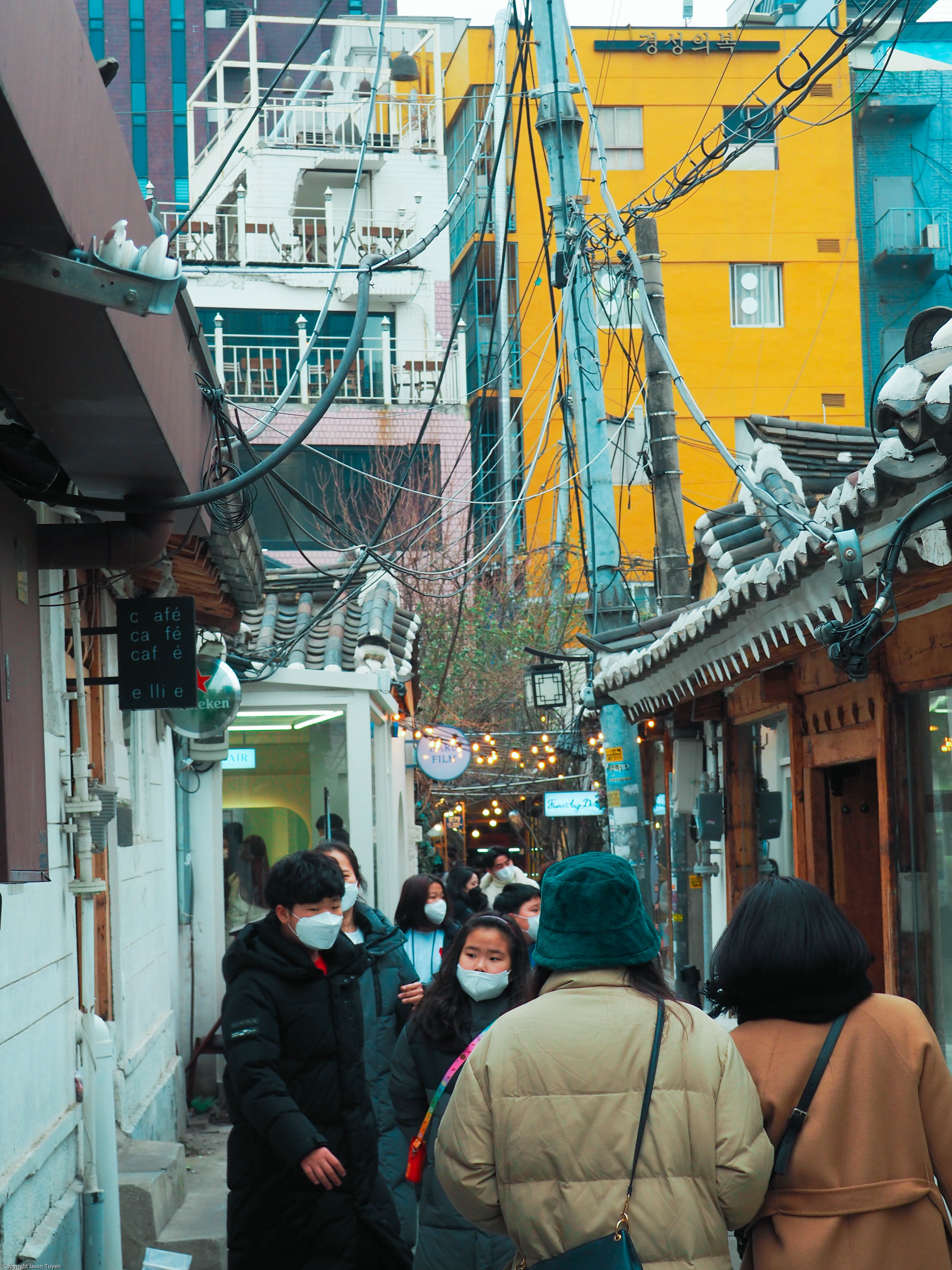 Crowd of people walking the tight streets of Insadong.